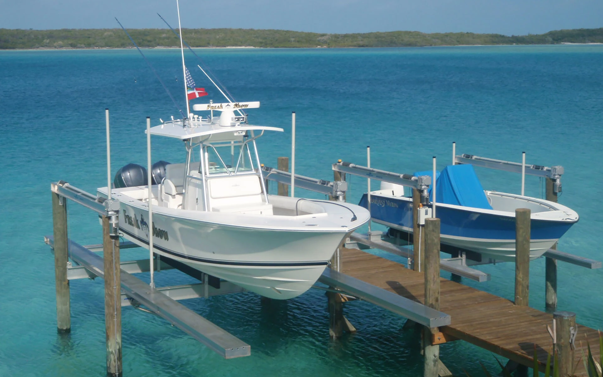 Boat lifts for multiple large luxury boats on the ocean